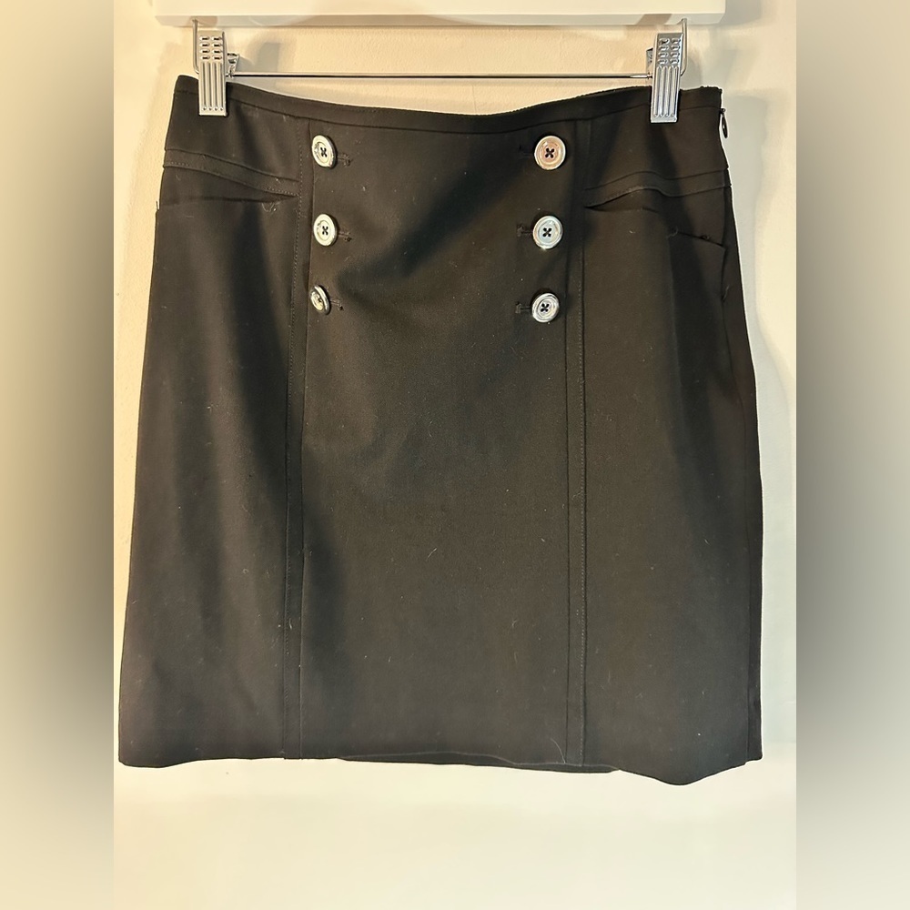 White House black market . Black skirt stylish button on front side zip .